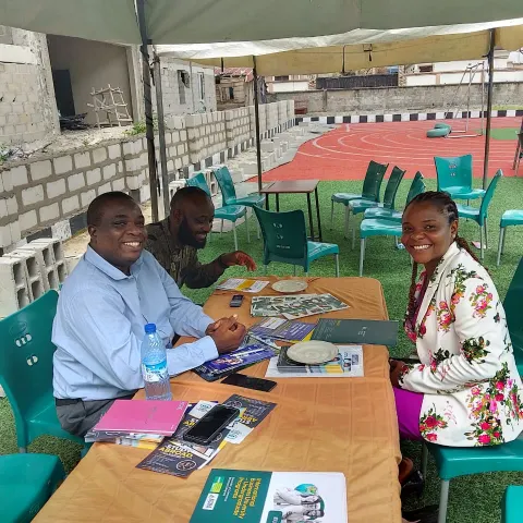 An EEA counsellor advising students at a school education fair
